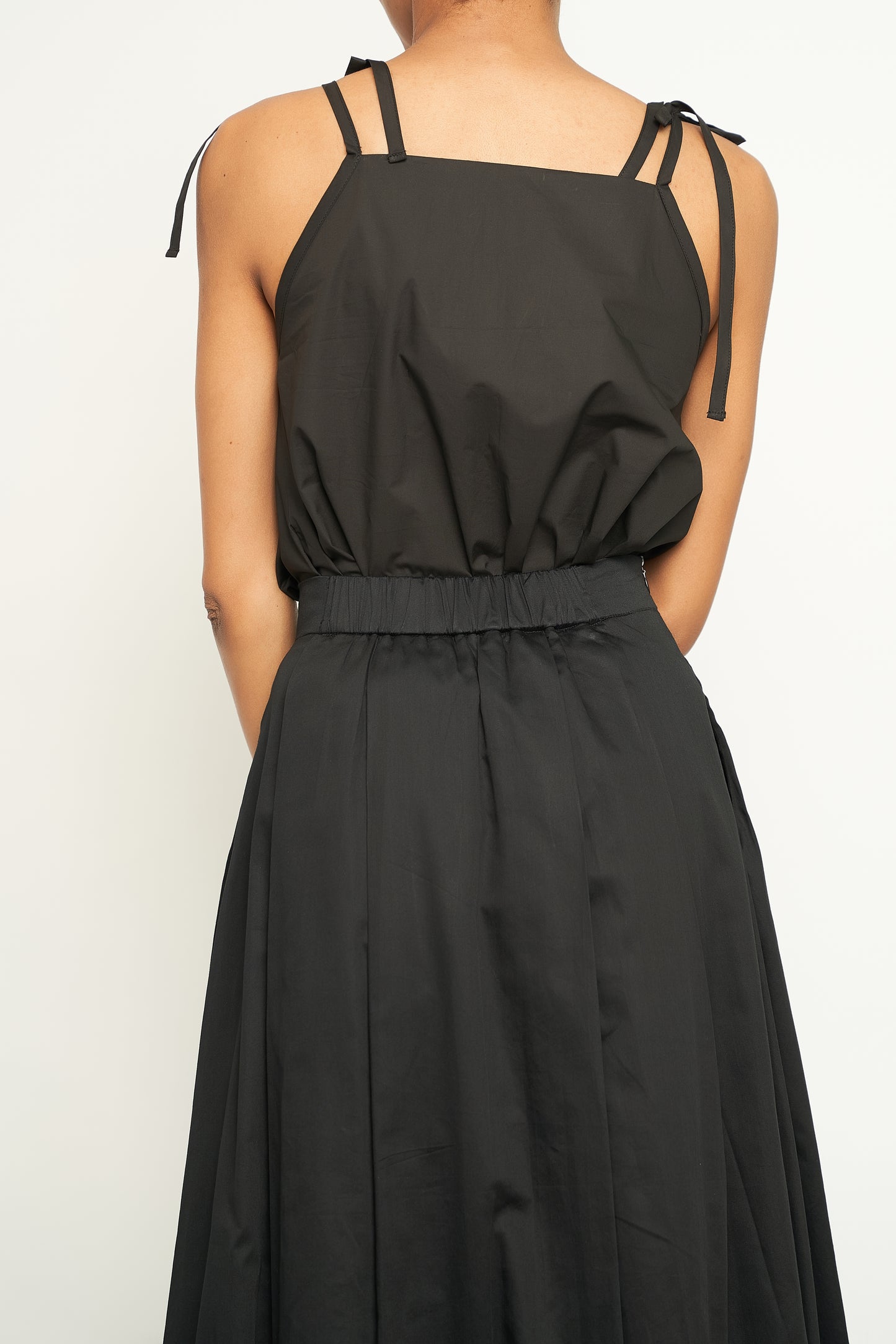 PLEATED SKIRT & STRINGS ATTACHED TOP